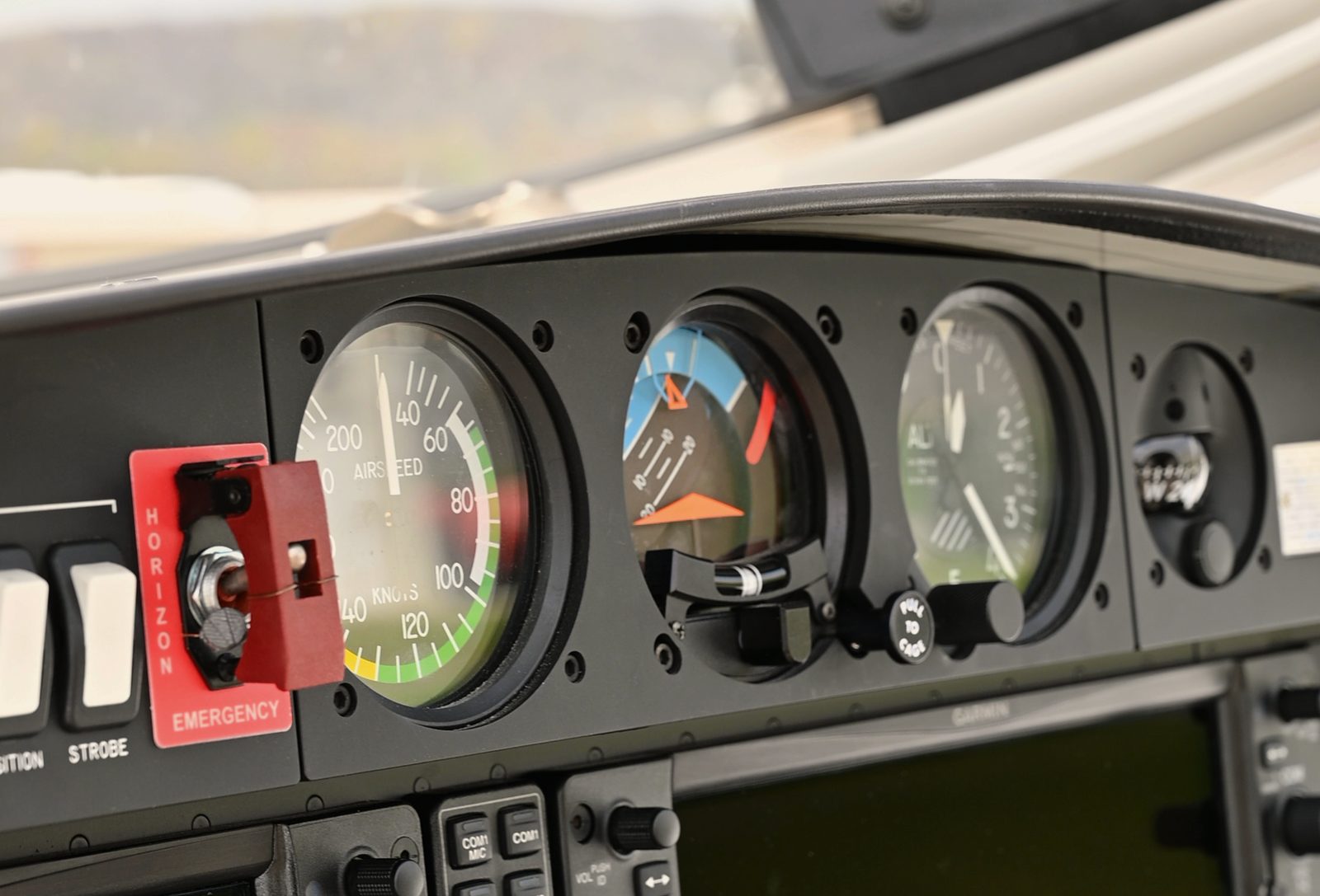 Close-up of standby flight instruments on a glass-cockpit panel