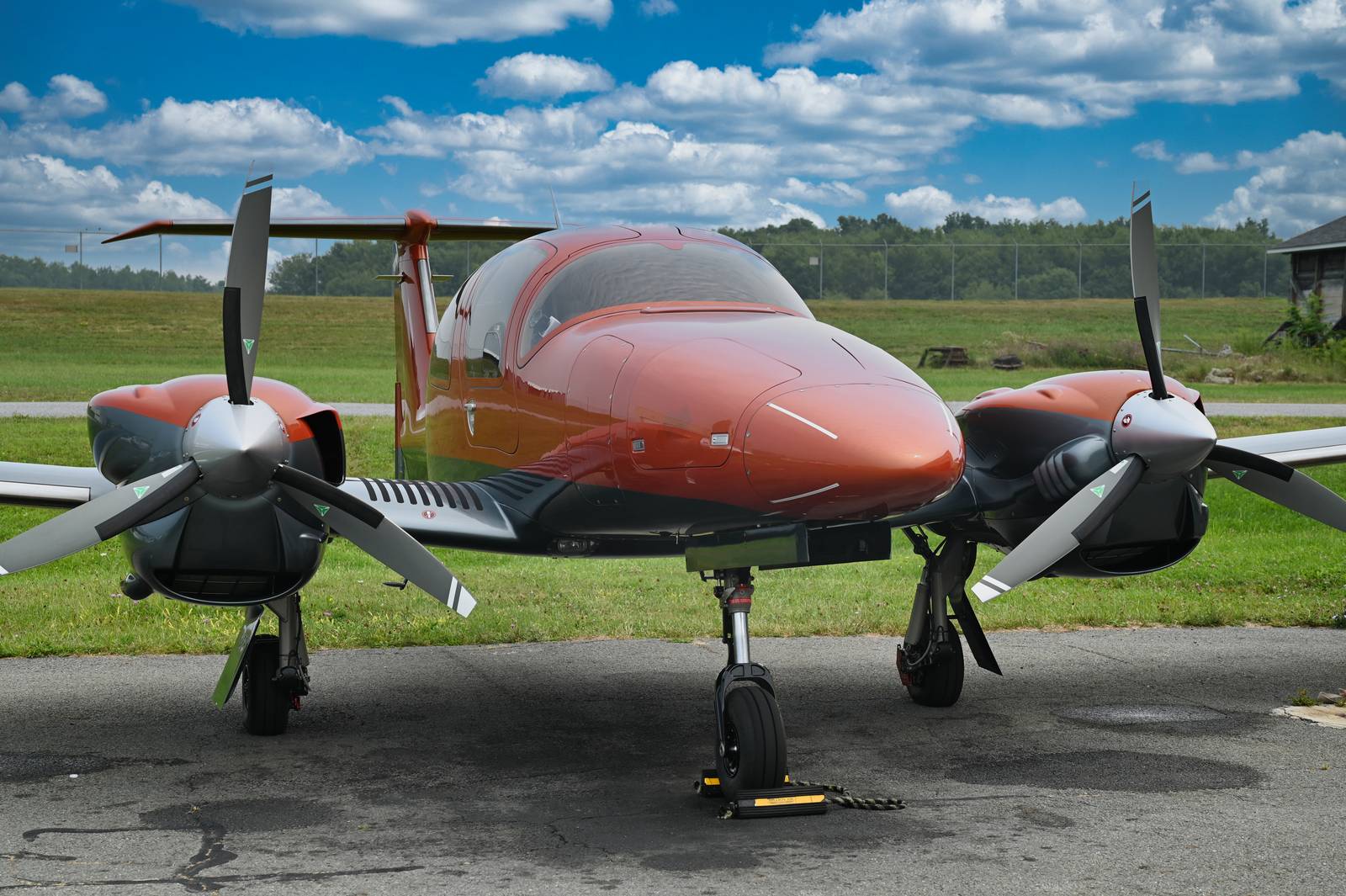 Front view of an orange twin with both propellers